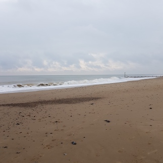 line of clouds over North Norfolk sea and beach