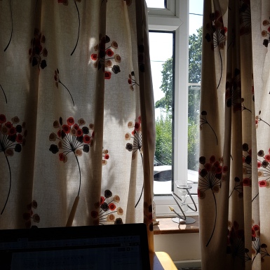 image of vintage curtains and window slightly open